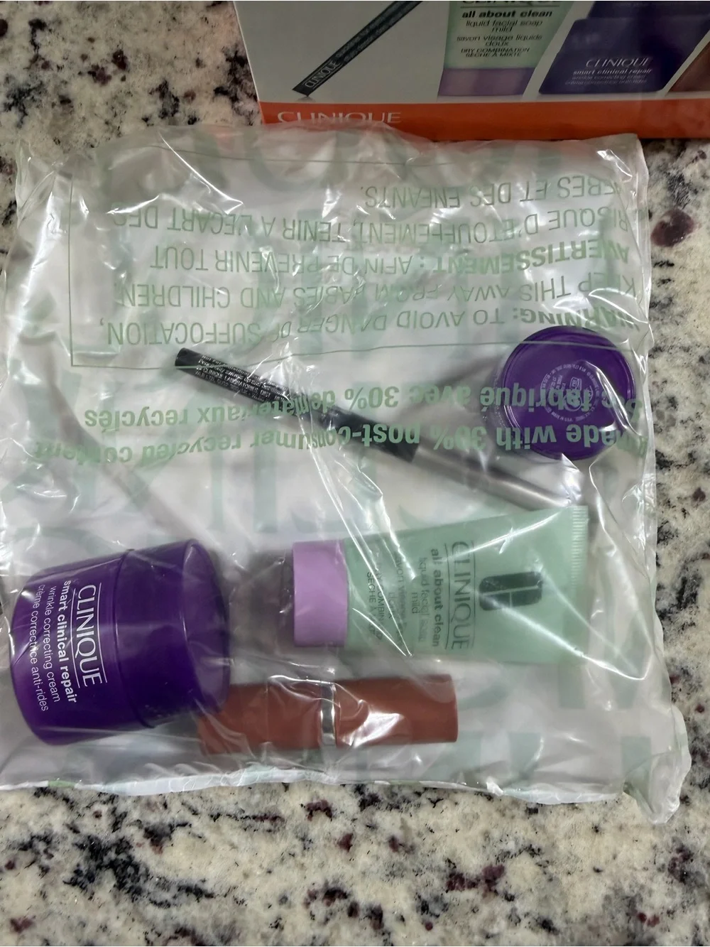 Clinique Makeup Set with Purple Floral Cosmetic Bag & extra lipstick / liner